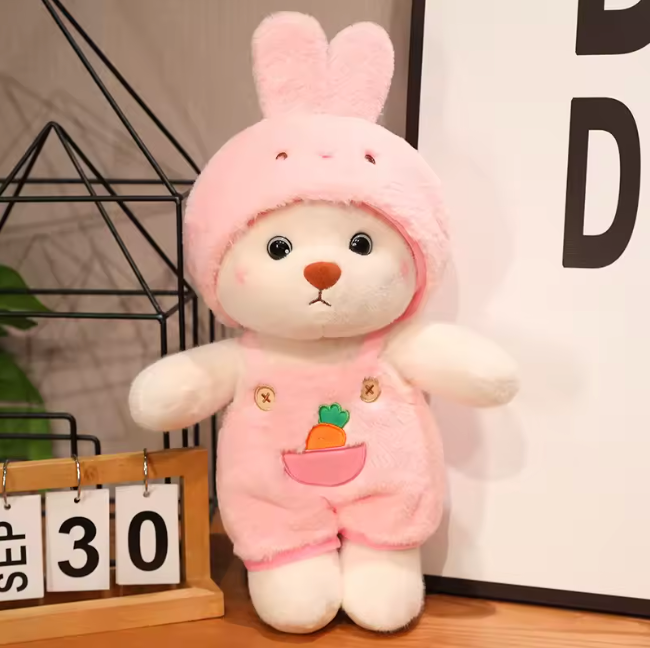 Bear dressed in a pink bunny outfit!