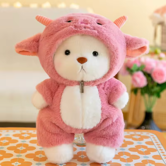 Plush bear dressed in a pink cow outfit!
