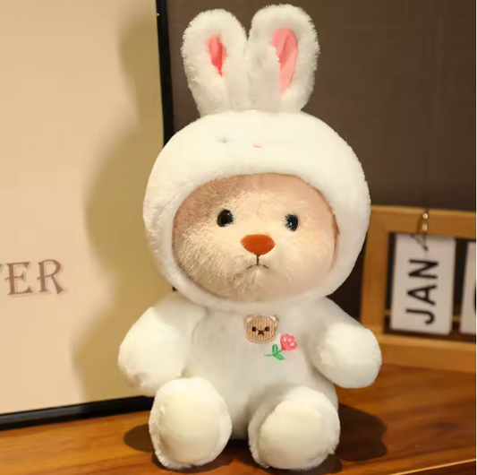 Plush bear dressed in a white bunny outfit
